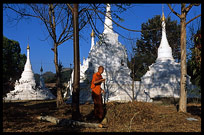A monk is cleaning the monastery at Dhamma Yon.