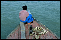 A captain and his boat on the Ayeyarwady river.