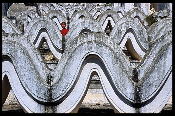 A monk at Hsinbyume Paya in the ancient city Mingun.