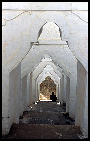 A monk at Hsinbyume Paya in the ancient city Mingun.