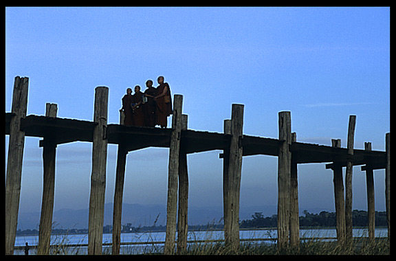 Monks crossing the U Bein Bridge at Amarapura.