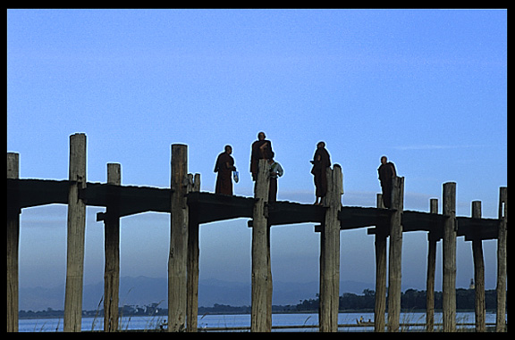 Monks crossing the U Bein Bridge at Amarapura.