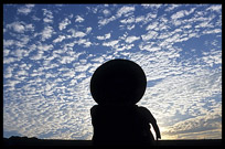 A silhouette of a Burmese man on the u Bein Bridge.