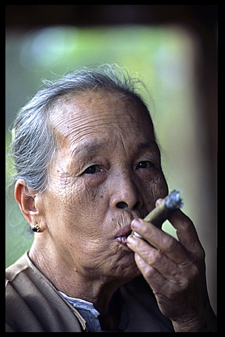 A tribeswoman smoking a cheroot near Hsipaw.