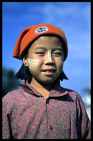 A Burmese girl wearing a western style hat in Hsipaw.