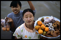 Burmese women selling fruit on the Ayeyarwady River.