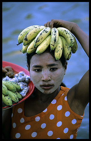 A Burmese woman selling fruit on the Ayeyarwady River.