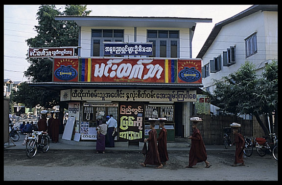 Monks in Pyay are walking down the street asking for gifts and food.