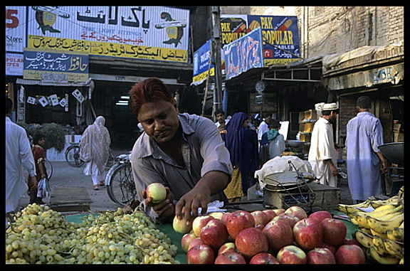 A merchant in the Hussain Agahi Bazaar. Multan, Pakistan