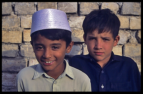 Two young boys at the local mosque. Taxila, Pakistan