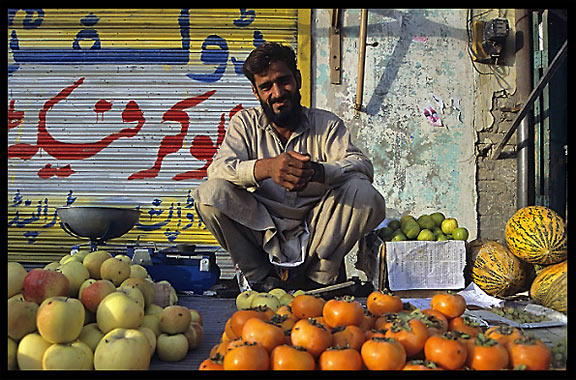 A Pakistani merchant selling fruit. Taxila, Pakistan