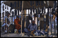 Repairing shoes. Taxila, Pakistan