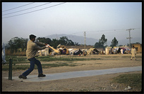 Playing cricket in an Afghan refugee camp. Taxila, Pakistan