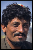 Portrait of an Afghan refugee at the Afghan horse market. Peshawar, Pakistan