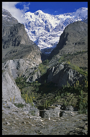 The old cemetery with Diran (7270m) in the background. Karimabad, Hunza, Pakistan