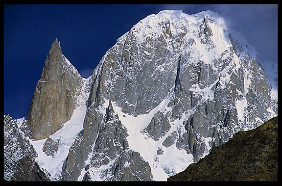 A black pinnacle, Bubulimating (6000m) also called Lady Finger. Karimabad, Hunza, Pakistan