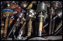 Tibetan bells, praying wheels and singing bowls are among the many souvenirs found in the stalls around the Jokhang. Lhasa, Tibet, China