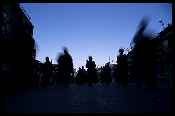 Pilgrims walking the Barkhor Kora early morning during full moon.