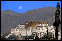 The moon sets over the Potala Palace from the roof of the Jokhang. Lhasa, Tibet, China