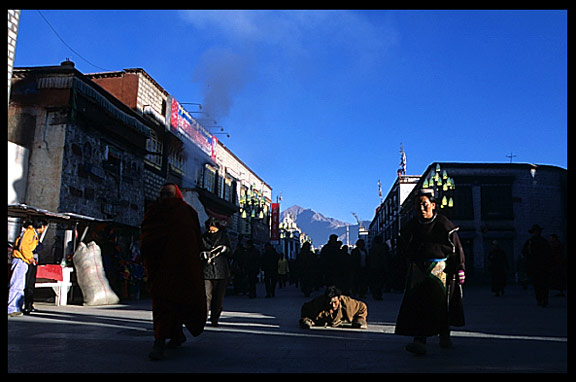 A pilgrim prostrating on the Barkhor Kora.