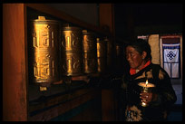 Prayer wheels, yak-butter lamps, a Tibetan pilgrim and the ethernal knot. Lhasa, Tibet, China