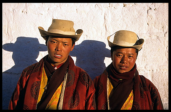 Young cowboy-style tibetan pilgrims. 