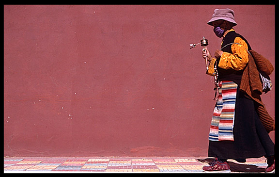 A nun is walking the Lingkhor Kora in Lhasa.