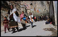 A family of Tibetan pilgrims follow the Lingkhor Kora. Lhasa, Tibet, China