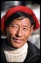 The Tibetan owner of one of the many stalls on the Barkhor Kora. Lhasa, Tibet, China