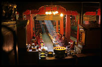Tibetan monks praying at Drepung Monastery. Lhasa, Tibet, China