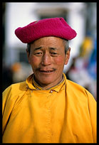 A colourful Tibetan pilgrim on the Lingkhor Kora. Lhasa, Tibet, China