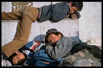 Sleeping Tibetan children in front of the Jokhang. Lhasa, Tibet, China