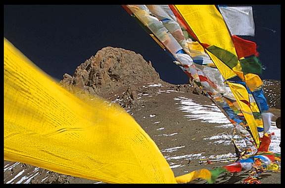 Prayer flags on the last mountain pass before Nam Tso.