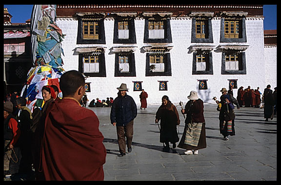 Pilgrims and monks walking the Barkhor Kora.