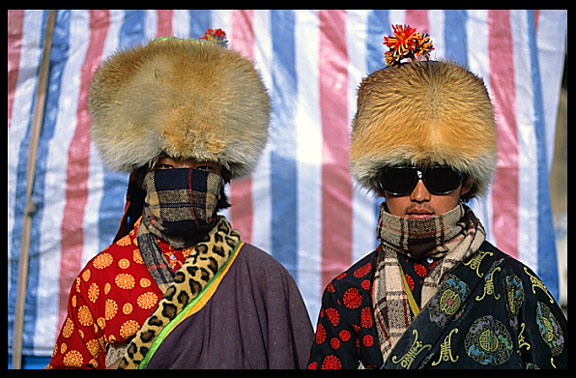 Two very colourful pilgrims at walking the Kora at Nam Tso.