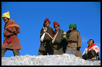 A colourful family of Tibetan pilgrims walking the Nam Tso Kora. Nam Tso, Tibet, China