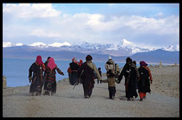 A family of Tibetan pilgrims walking the Nam Tso Kora. Nam Tso, Tibet, China