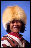 A smiling Tibetan pilgrim walking the Kora at lake Nam Tso. Nam Tso, Tibet, China