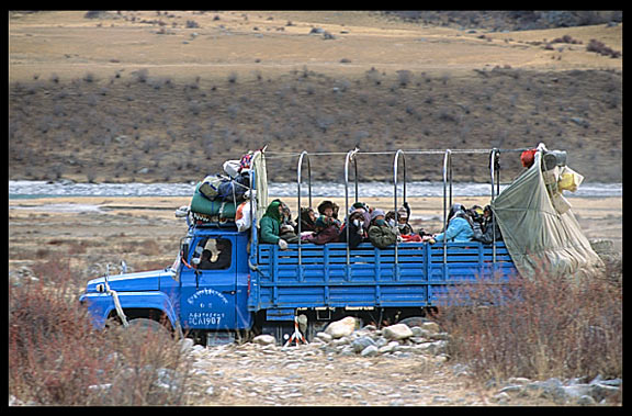 Pilgrims in a truck on their way to Reting monastery.
