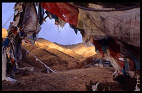 The main drtro at Drigung Til monastery, the holiest sky-burial site in the Lhasa region, at sunset. Tibet, China