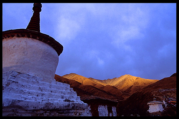 The main drtro at Drigung Til monastery, the holiest sky-burial site in the Lhasa region, at sunset.