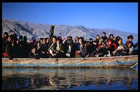 Tibetan pilgrims crossing the river to Samye Monastery. Tibet, China