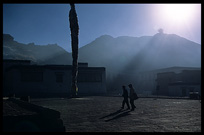 Silhouettes of Tibetan pilgrims at Pelkor Chde Monastery in Gyantse. Tibet, China