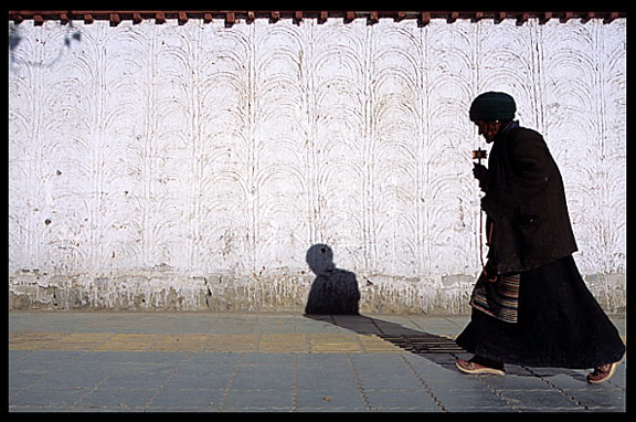 A pilgrim walks the Kora at Shigatse.