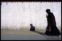 A Tibetan pilgrim walks the Kora at Shigatse. Tibet, China